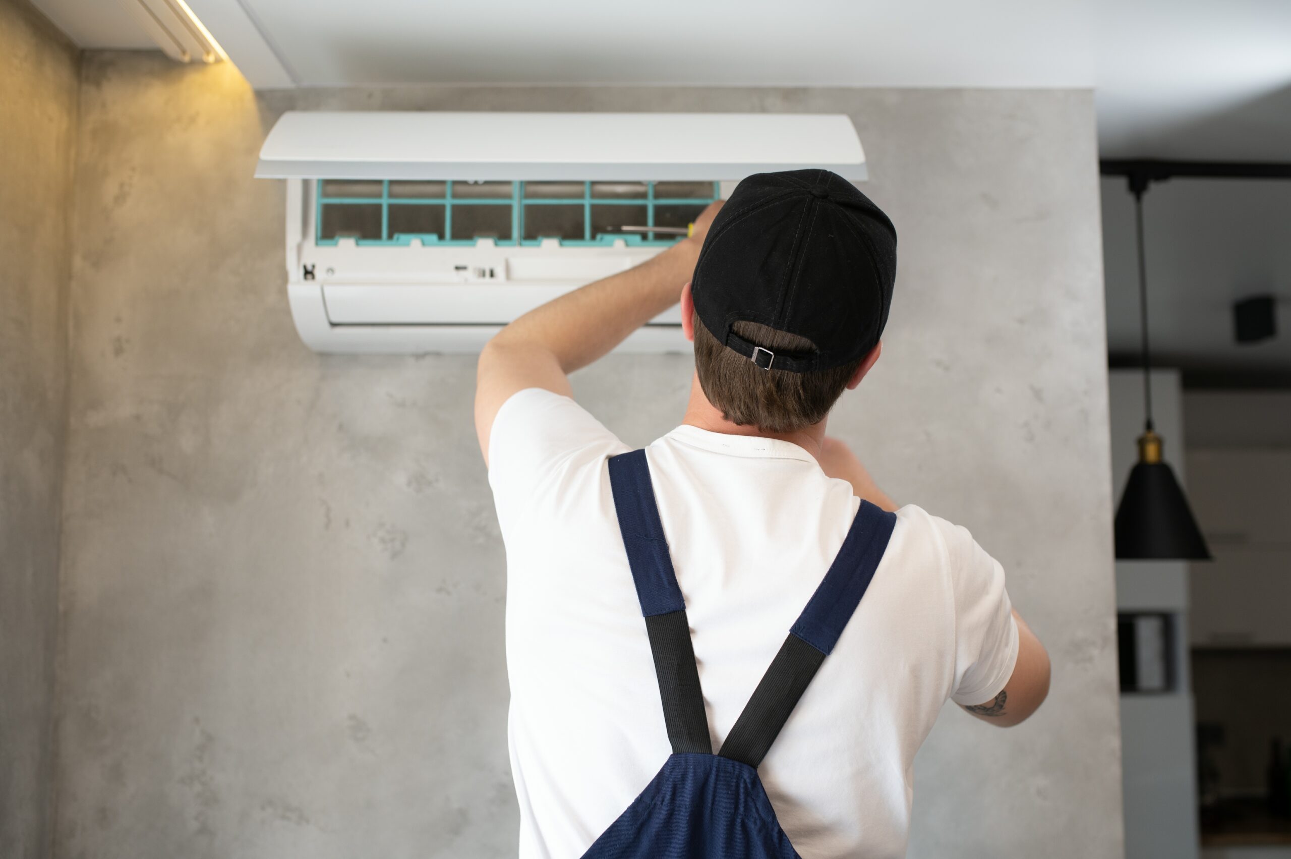 HVAC technician providing professional emergency AC repair for a broken home air conditioning system.