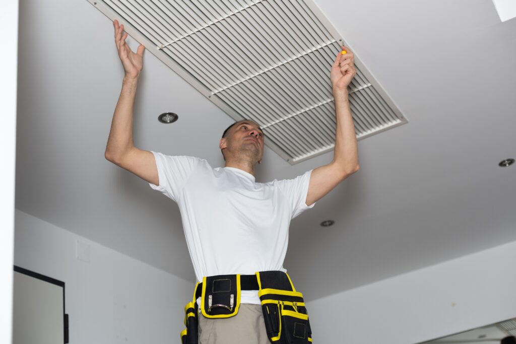 Technician performing professional heating installation for a modern home comfort system.