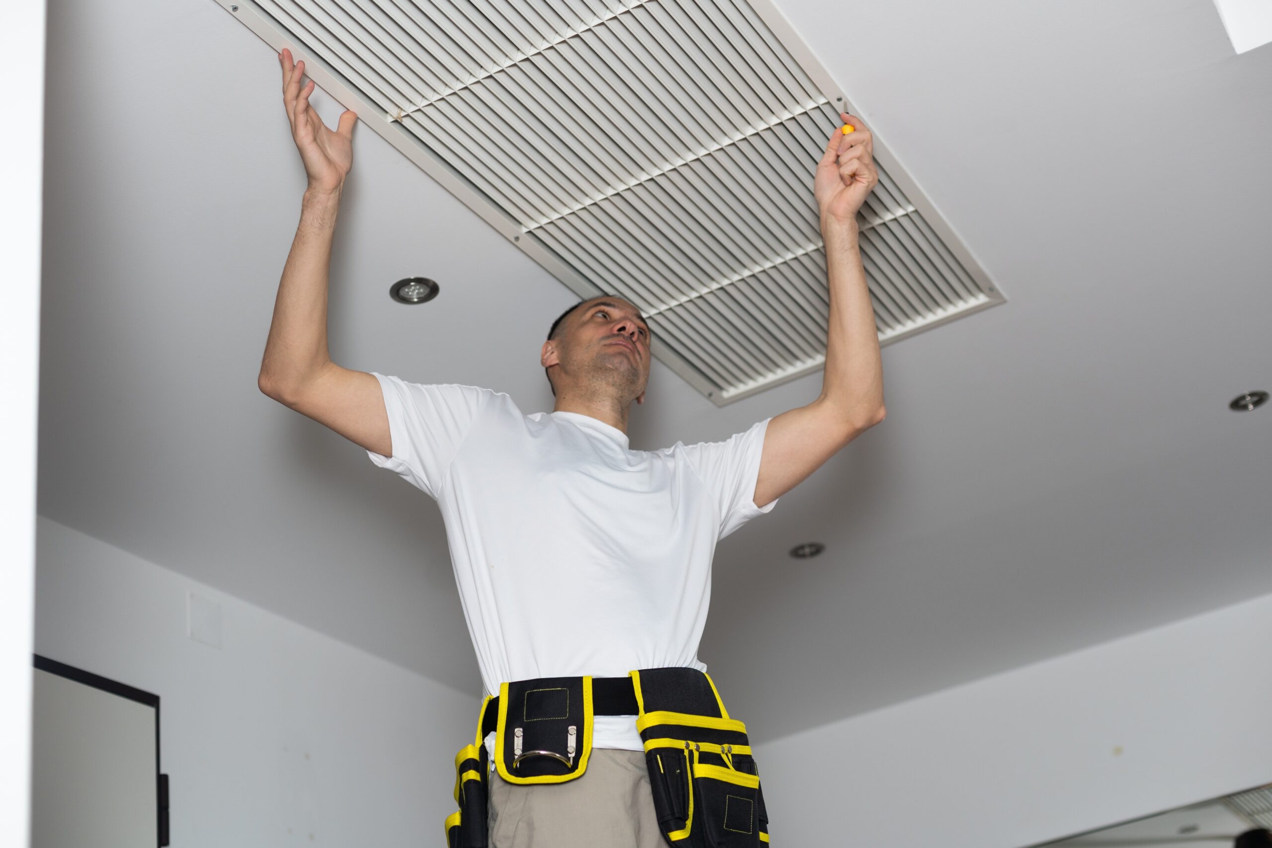 Technician performing professional heating installation for a modern home comfort system.