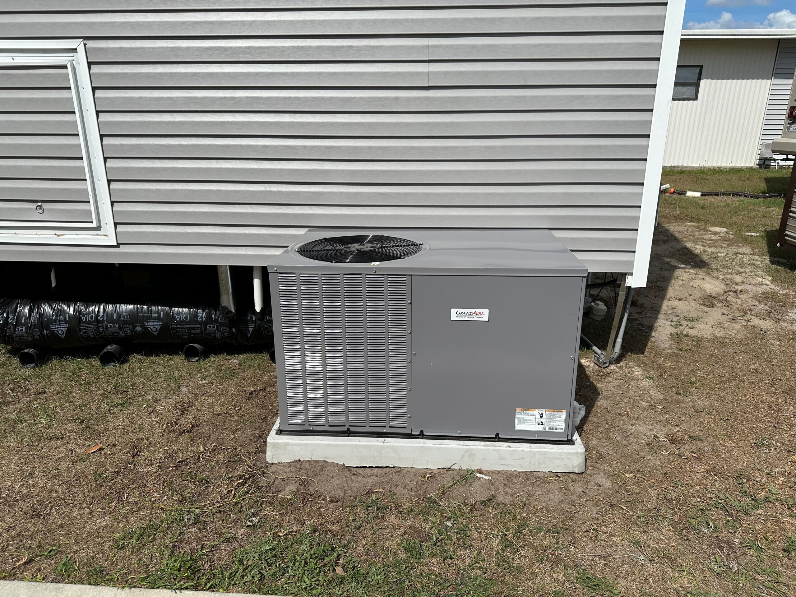 HVAC technician diagnosing an AC not turning on after power outage following a summer electrical outage.