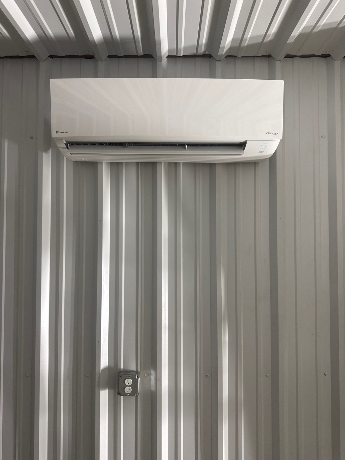 Modern ductless mini-split providing efficient cooling after Florida sunroom mini-split installation in a bright enclosed sunroom.